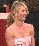 Cameron Diaz rocks the just got done with yoga pony tail with a boring seashell origami thing